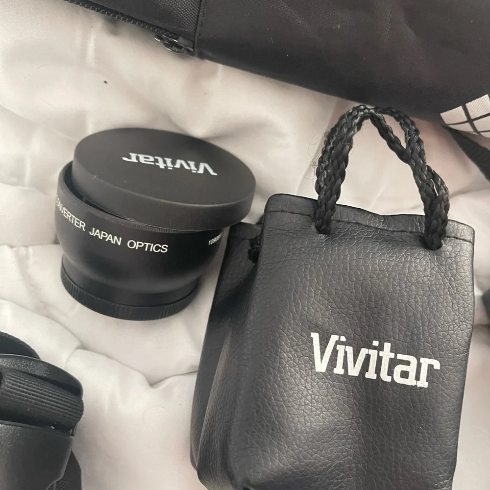 Nikon D3200 with multiple lenses, tons of attachments and comes with accessories